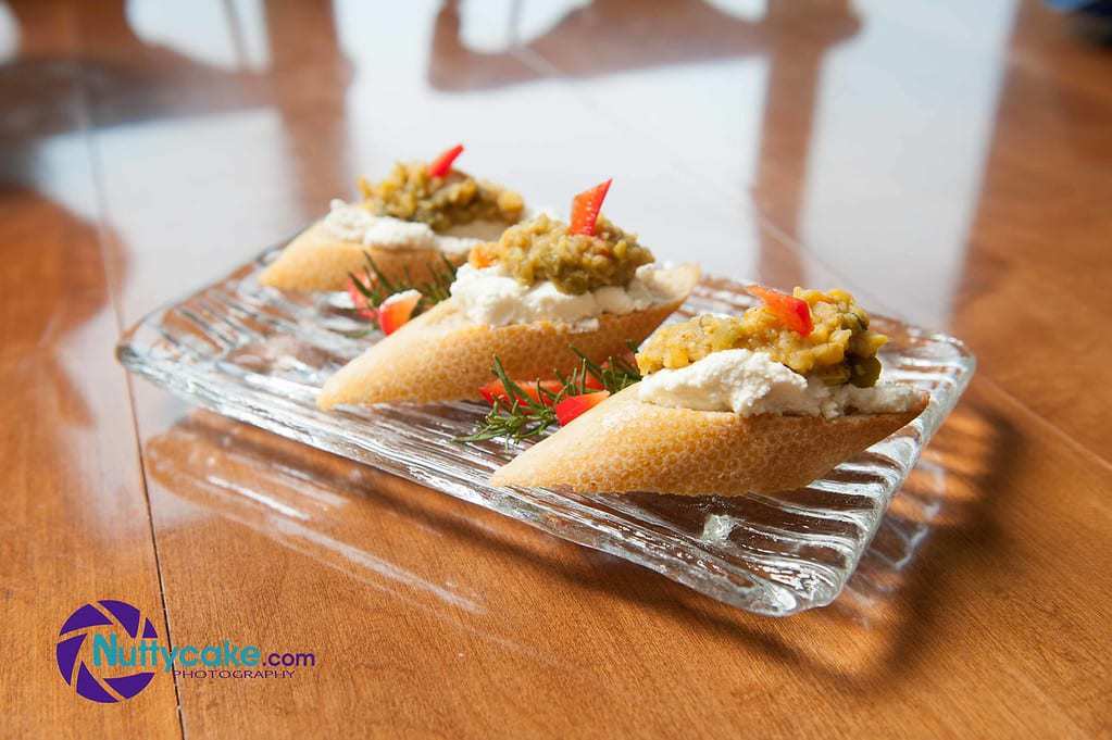 Fresh Ricotta Cheese on Garlic Crostinis Topped with Ginger Coconut Dahl